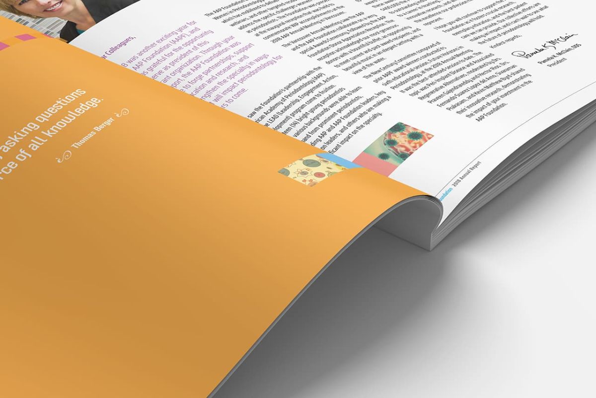 a zoomed picture of the button half of an open copy of the annual report