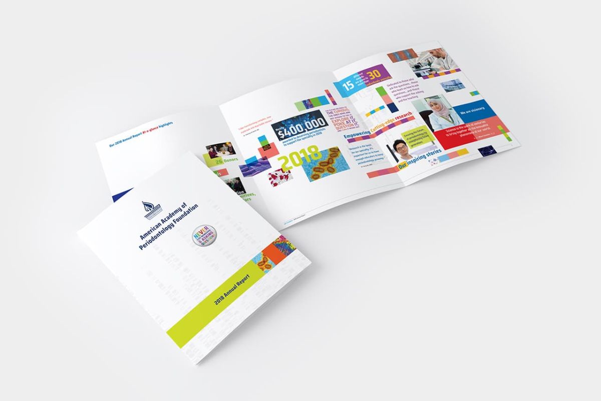 overhead view of multiple copies of the AAPF 2018 Annual Report showcasing NeigerDesign's printmaking integrated designs