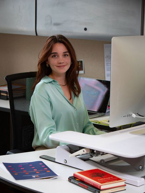 Jessie sitting at her desk